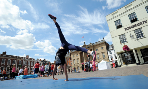 Girl cheer leading in Newark Market Place